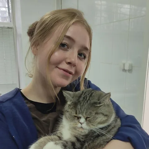 Mariia Dolgikh with a cat